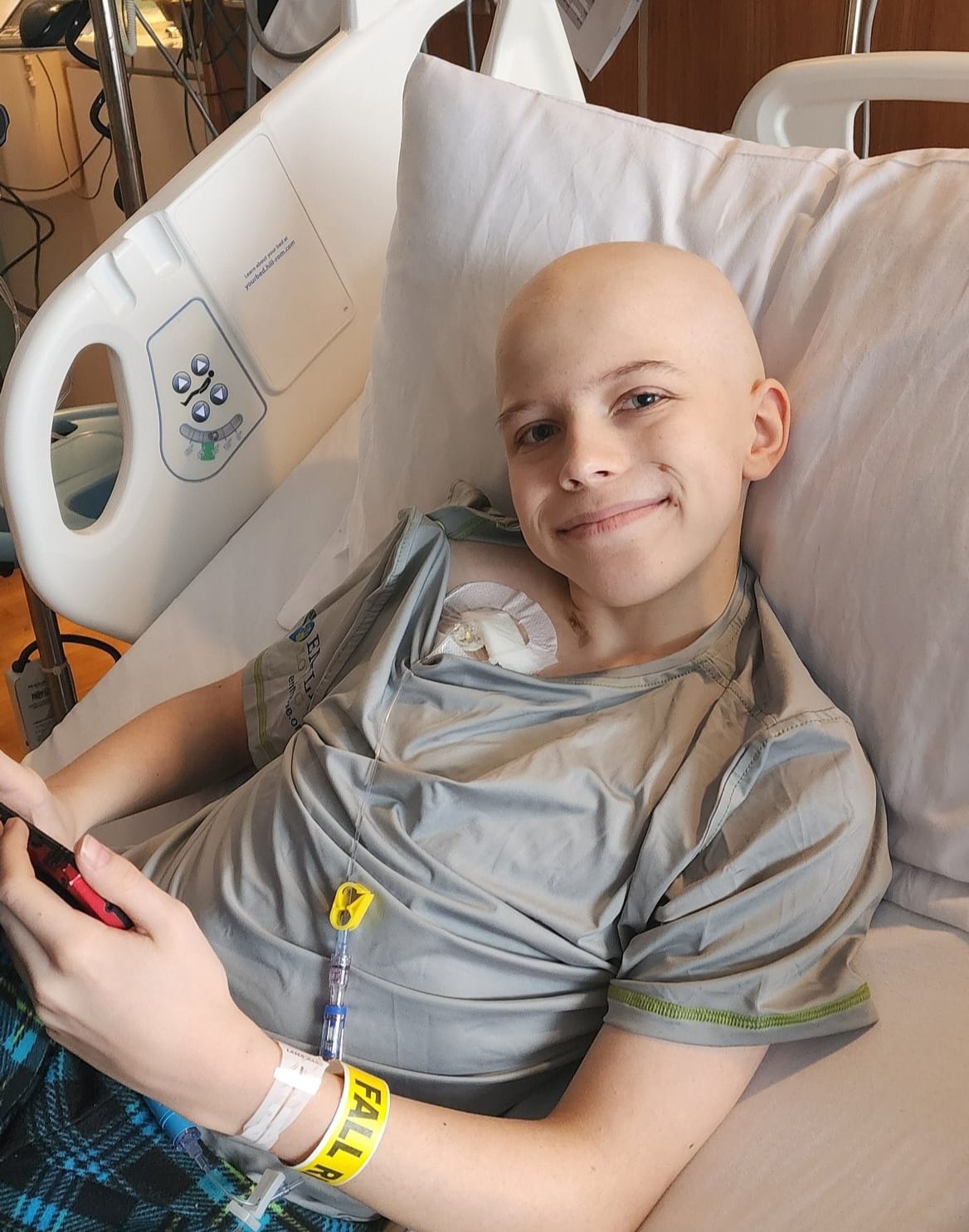 Asher smiling while at the hospital, showing his positive spirit