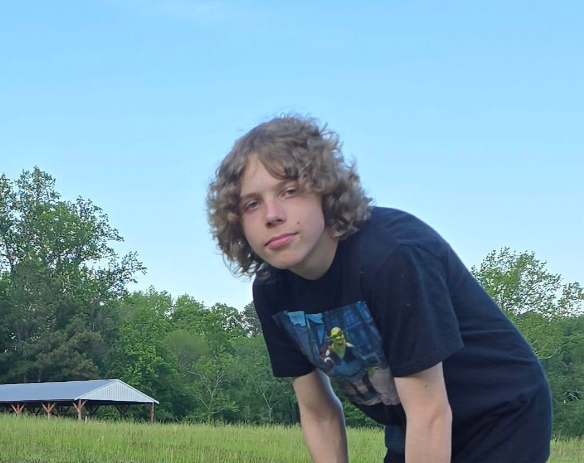 Image of Asher leaning over looking into the camera